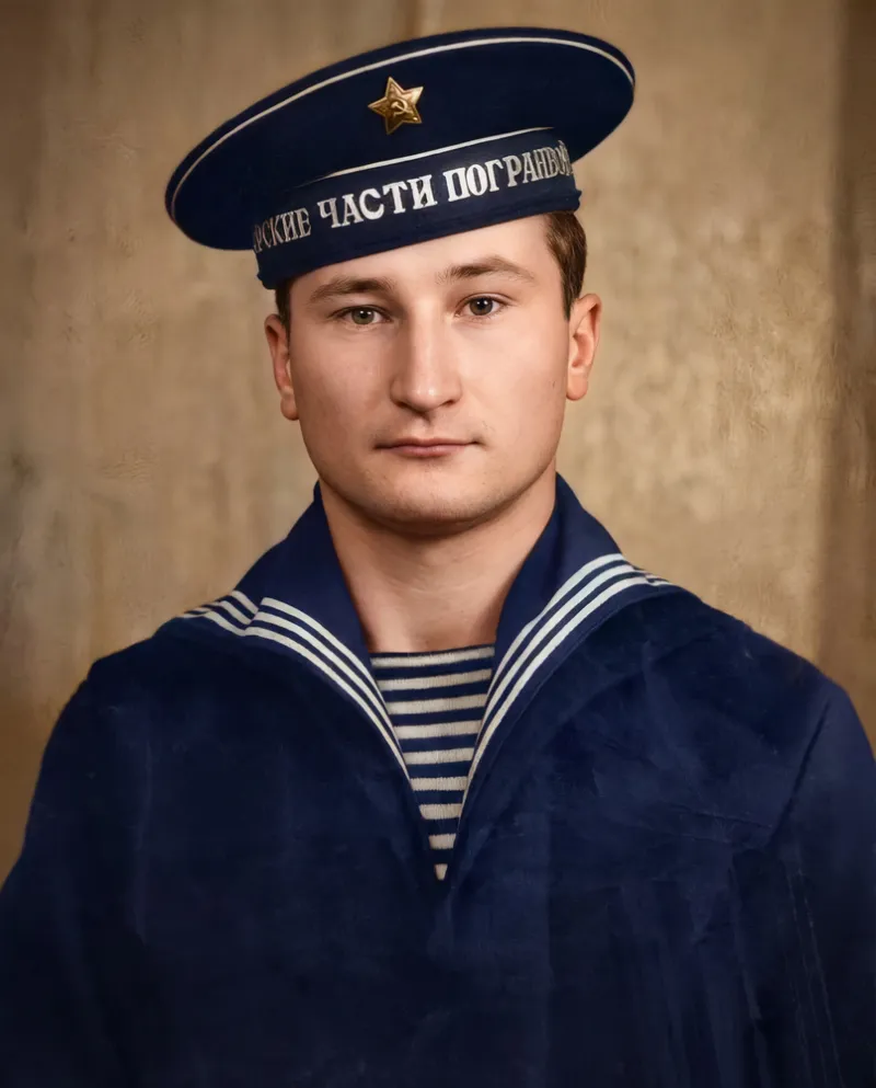 AI-restored and colorized photo — Heavy cracks and scratches across the entire photo — fully removed with face and uniform detail restored